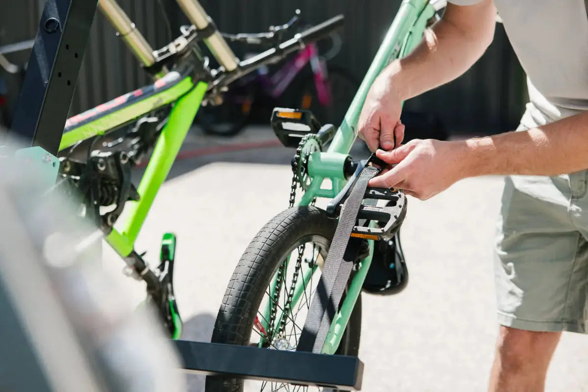 Man adjusting a bike onto a JB Racks bike rack